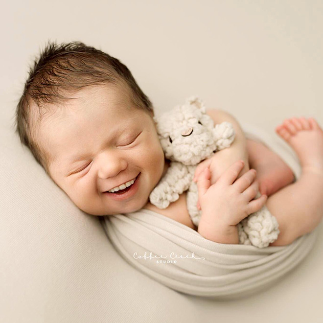 Photographer Adds Smiles On Professional Baby Photos And It's… Terrifying